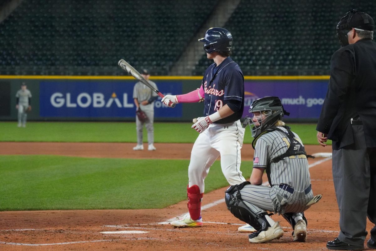 Senior Finn Leach up at bat in game against Highline playing at T-Mobile park in their annual ball park game.