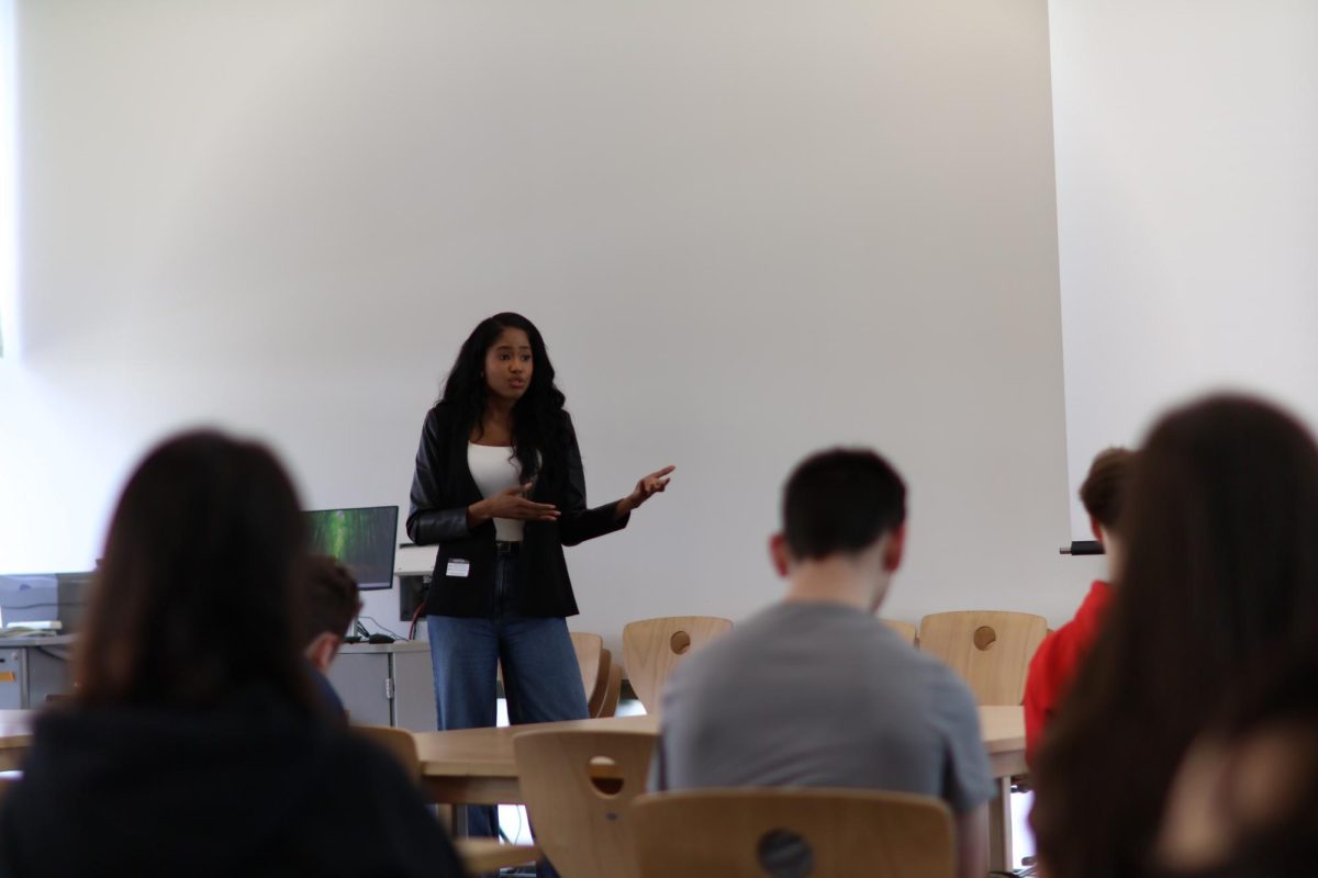 Siberah Rayford stands at the bow of the library, engaging the Sentinel and Heritage staffs in her story.
